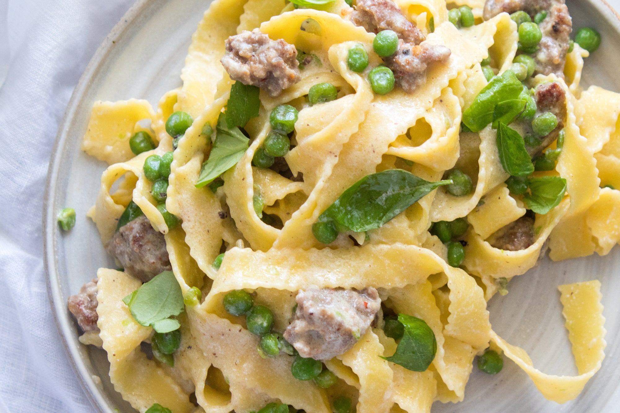 Tagliatelle with Peas, Sausage & Ricotta, Credit: Elizabeth Newman