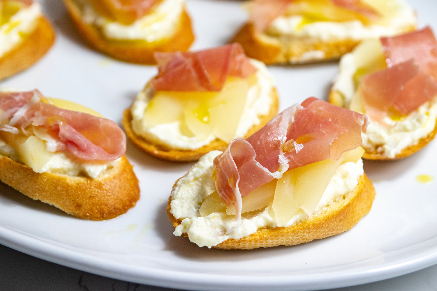 Poached Pear And Prosciutto Crostini