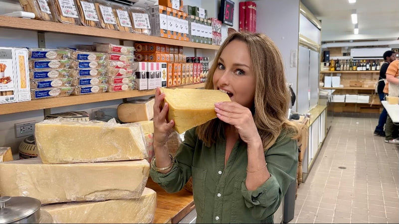 Giada holding parmesan and Parmigiano reggiano